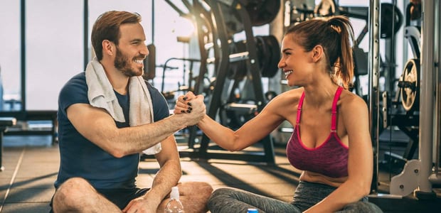 couple working out at gym together couple working out at gym together