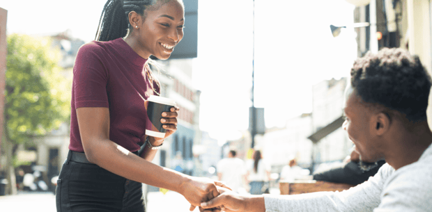 Woman shaking man's hand