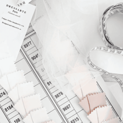 Photograph of Dressarte's measuring tape and fabric samples