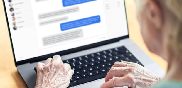 Photo of a senior person typing