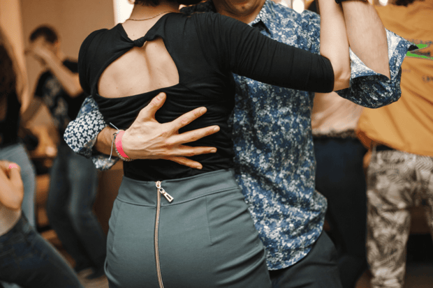 Young man and woman learning to dance