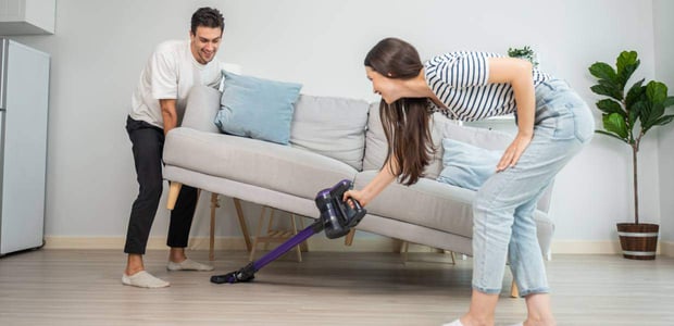 Photo of a couple cleaning