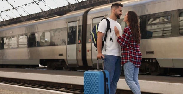 Photo of a couple at a train station Photo of a couple at a train station