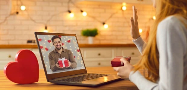 Photo of a couple talking over video call Photo of a couple talking over video call
