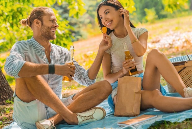 Couple having picnic in park