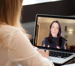 Sara Davison speaking through video call laptop Sara Davison speaking through video call laptop
