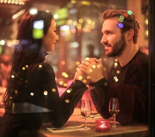 Insight Counseling Center couple in restaurant holding hands