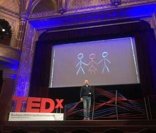 Photo of LÃ¡szlÃ³ Ãgoston speaking at a Ted Talk