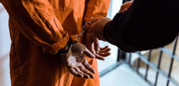 Photo of a man in handcuffs