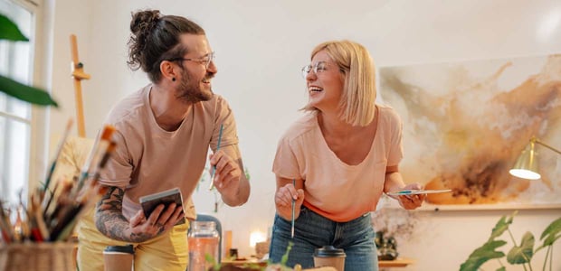 Couple painting at home