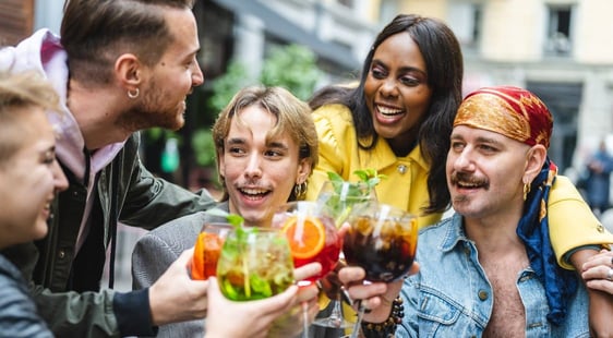 Friend group with drinks smiling Friend group with drinks smiling