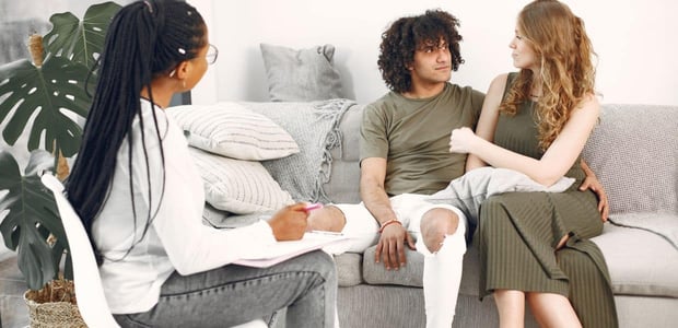 Couple talking to a therapist.
