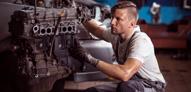 Photo of a male car mechanic Photo of a male car mechanic
