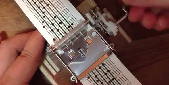 Photo of someone making a music box Photo of someone making a music box