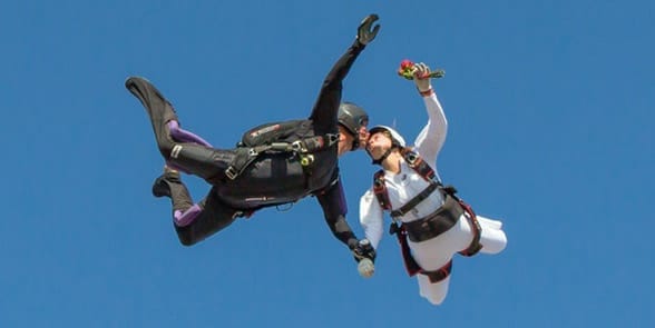 Photo of a couple skydiving Photo of a couple skydiving