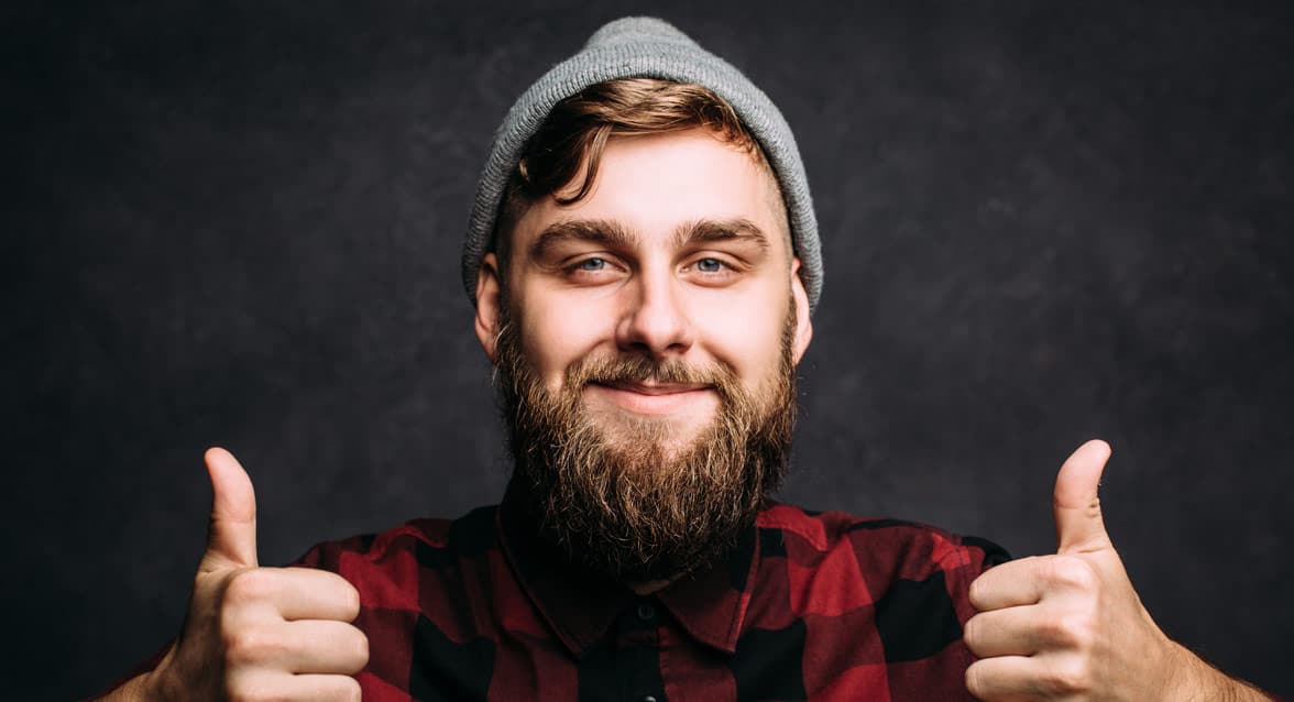 Photo of a man doing a thumbs up Photo of a man doing a thumbs up
