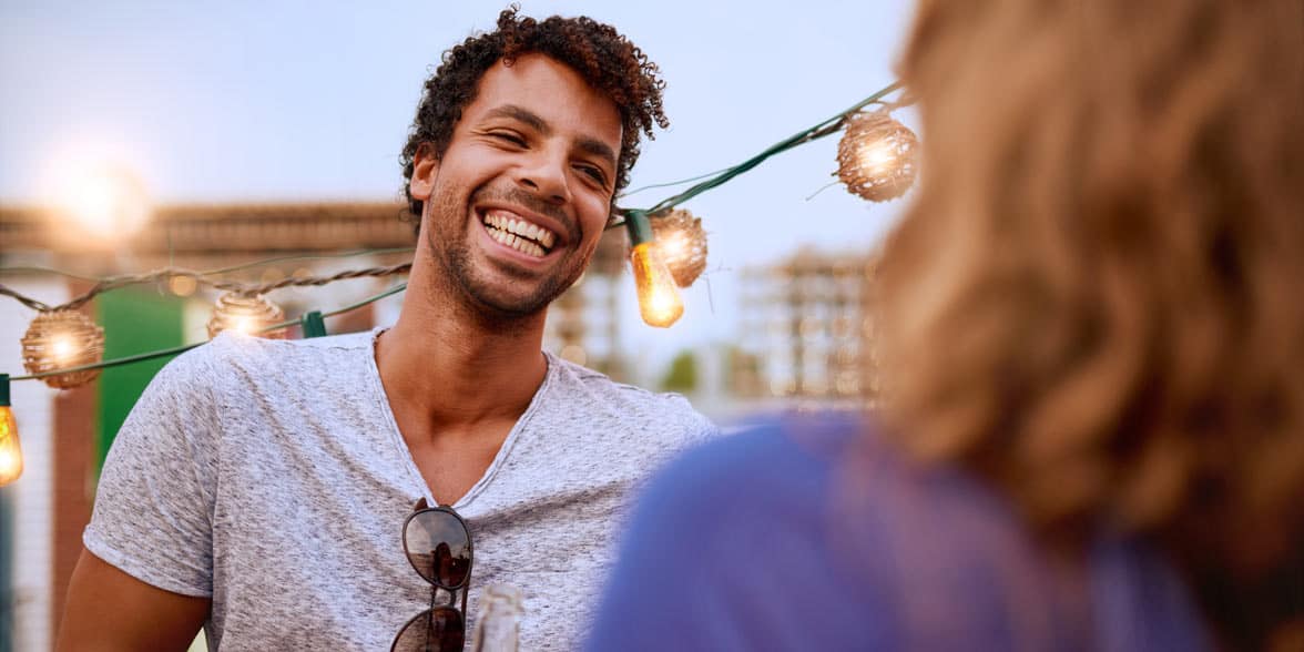 Photo of a man talking and smiling Photo of a man talking and smiling
